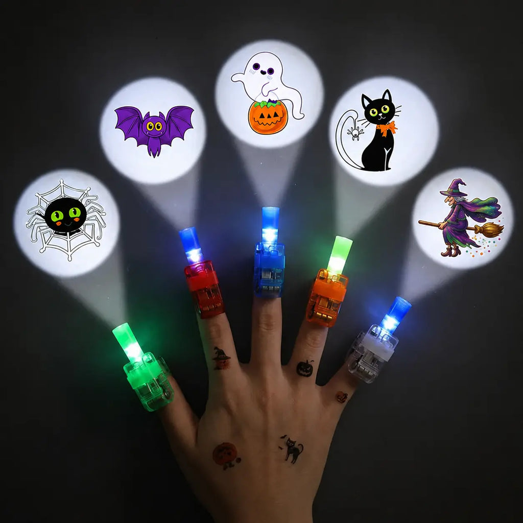 LED finger projector rings worn on a hand projecting a Halloween design