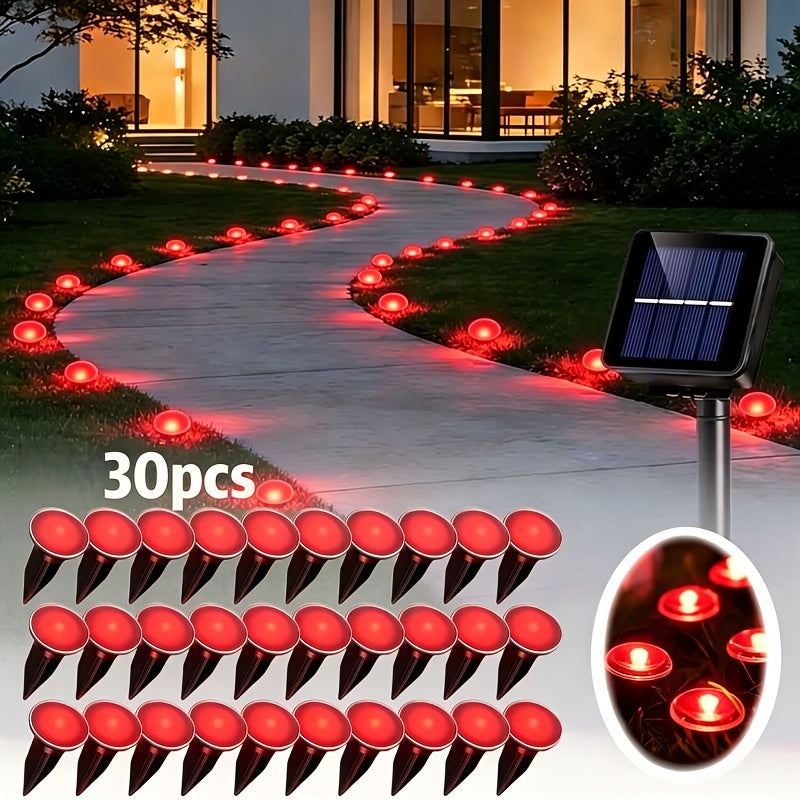 Solar pathway lights lining a walkway in assorted colors