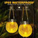 Solar hanging outdoor lantern warm amber LED waterproof decorative garden — amber glow close-up detail