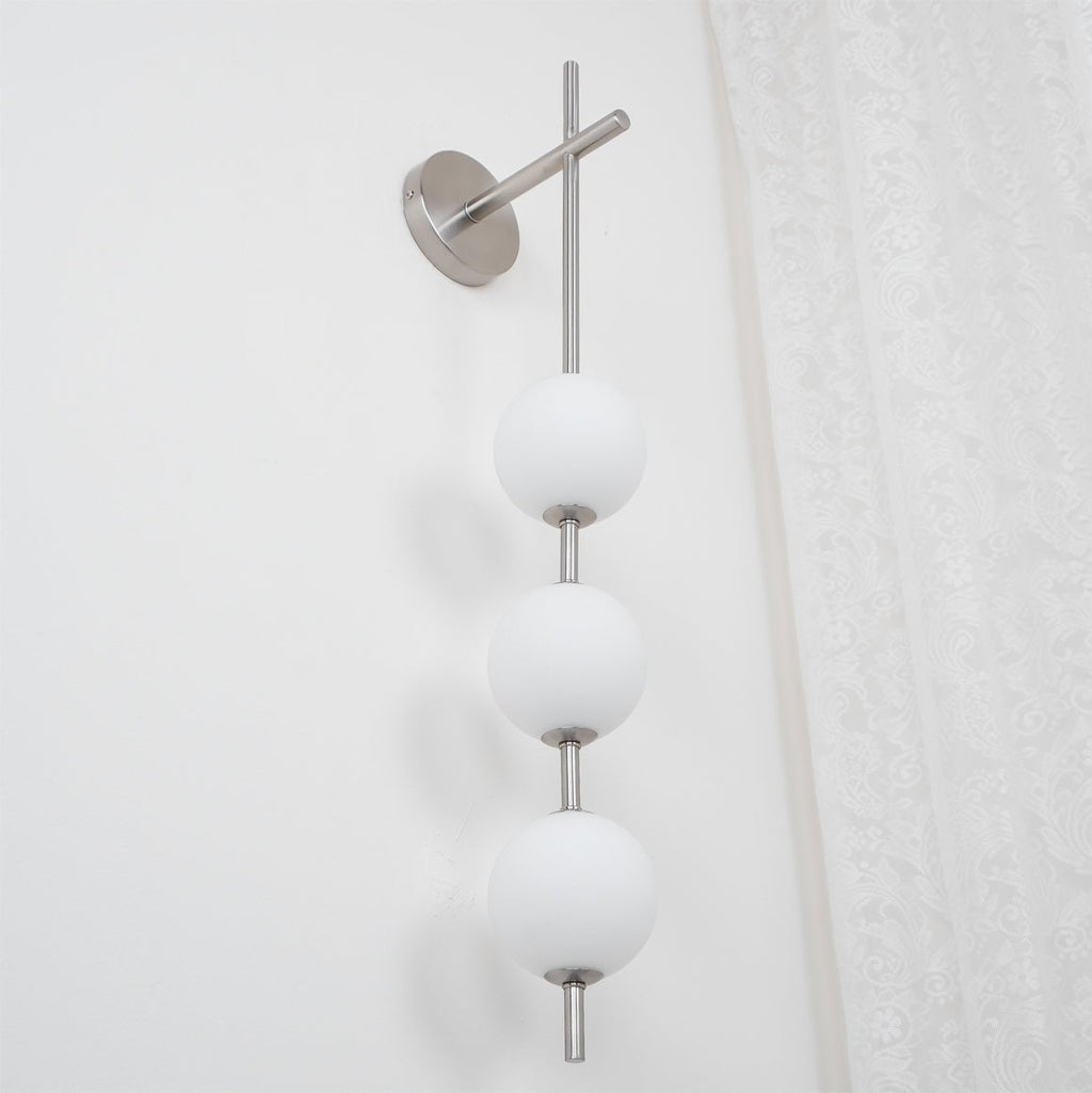 Cerin Vertical Globe Wall Lamp – Elegant Modern Lighting for Stylish Interiors