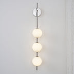 Cerin Vertical Globe Wall Lamp – Elegant Modern Lighting for Stylish Interiors