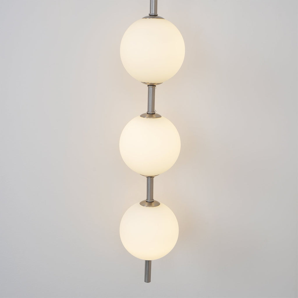 Cerin Vertical Globe Wall Lamp – Elegant Modern Lighting for Stylish Interiors