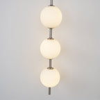 Cerin Vertical Globe Wall Lamp – Elegant Modern Lighting for Stylish Interiors