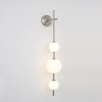 Cerin Vertical Globe Wall Lamp – Elegant Modern Lighting for Stylish Interiors
