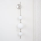 Cerin Vertical Globe Wall Lamp – Elegant Modern Lighting for Stylish Interiors