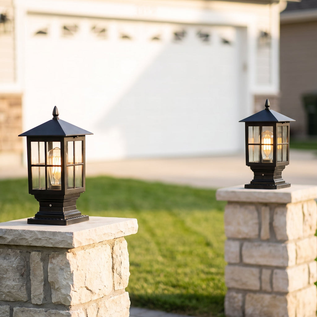Pair of Ironwood solar pillar lights flanking a driveway, daytime