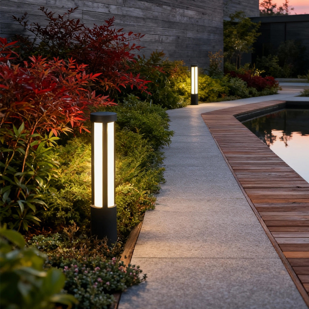 Residential bollard lights modern cylindrical LED landscape pathway — pathway landscape view