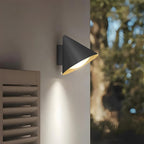 Close-up of Suzu Bell sconce showing the metal and acrylic bell shade construction